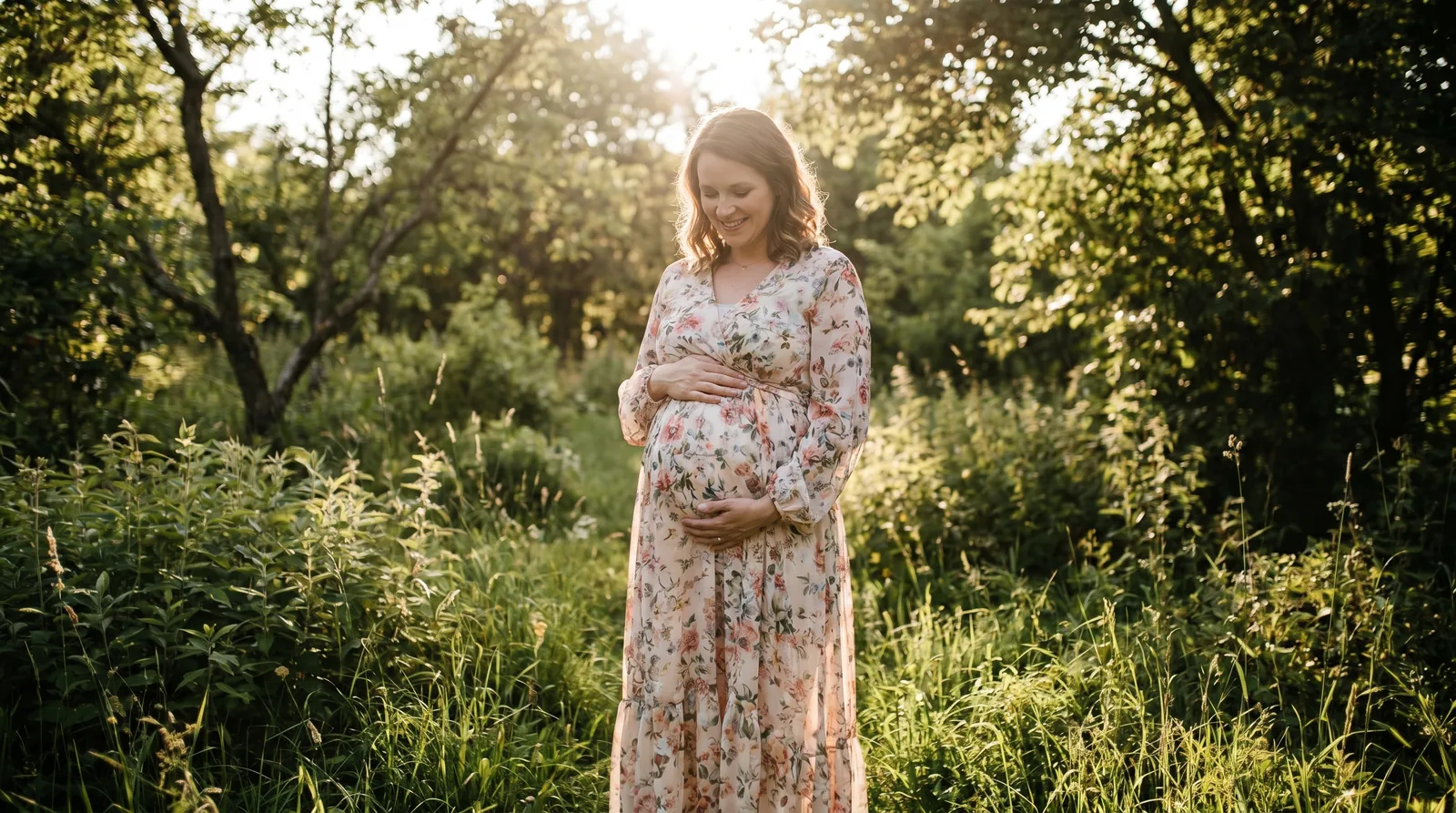 Pregnant woman in a floral dress cradling her belly outdoors, illustrating protein shake safety during pregnancy